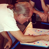 My dad playing scrabble while on vacation at Catalina Island 2 years ago.